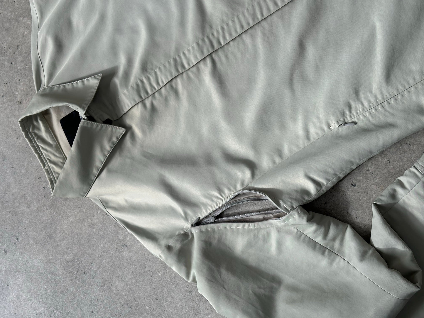 Gianfranco Ferre 1990s showerproof minimal jacket in size L, navy color, lightweight design, and clean silhouette.