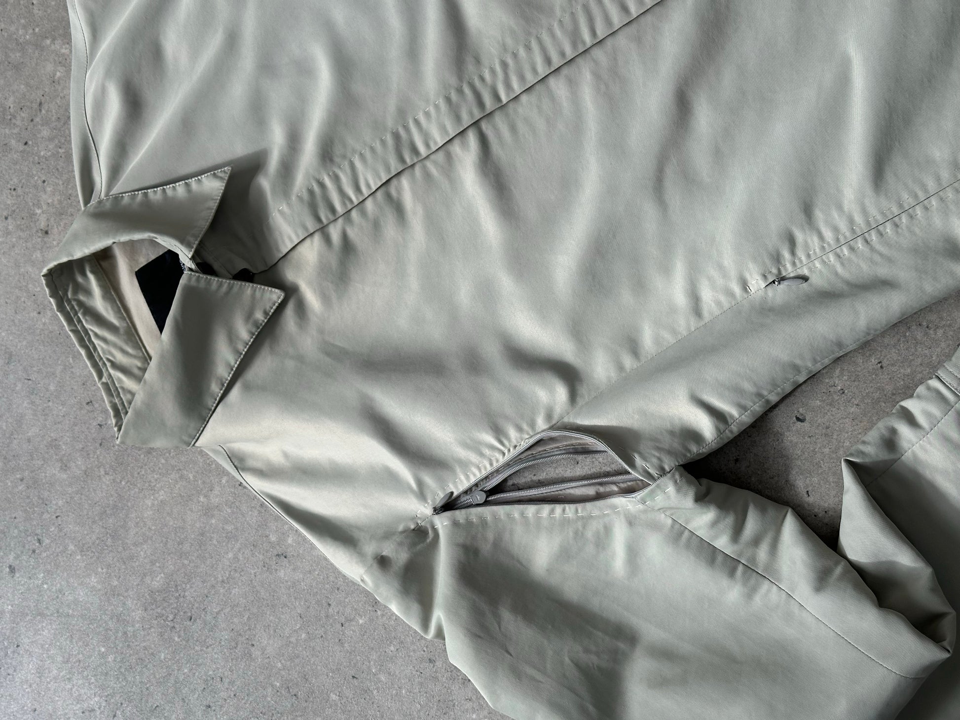 Gianfranco Ferre 1990s showerproof minimal jacket in size L, navy color, lightweight design, and clean silhouette.