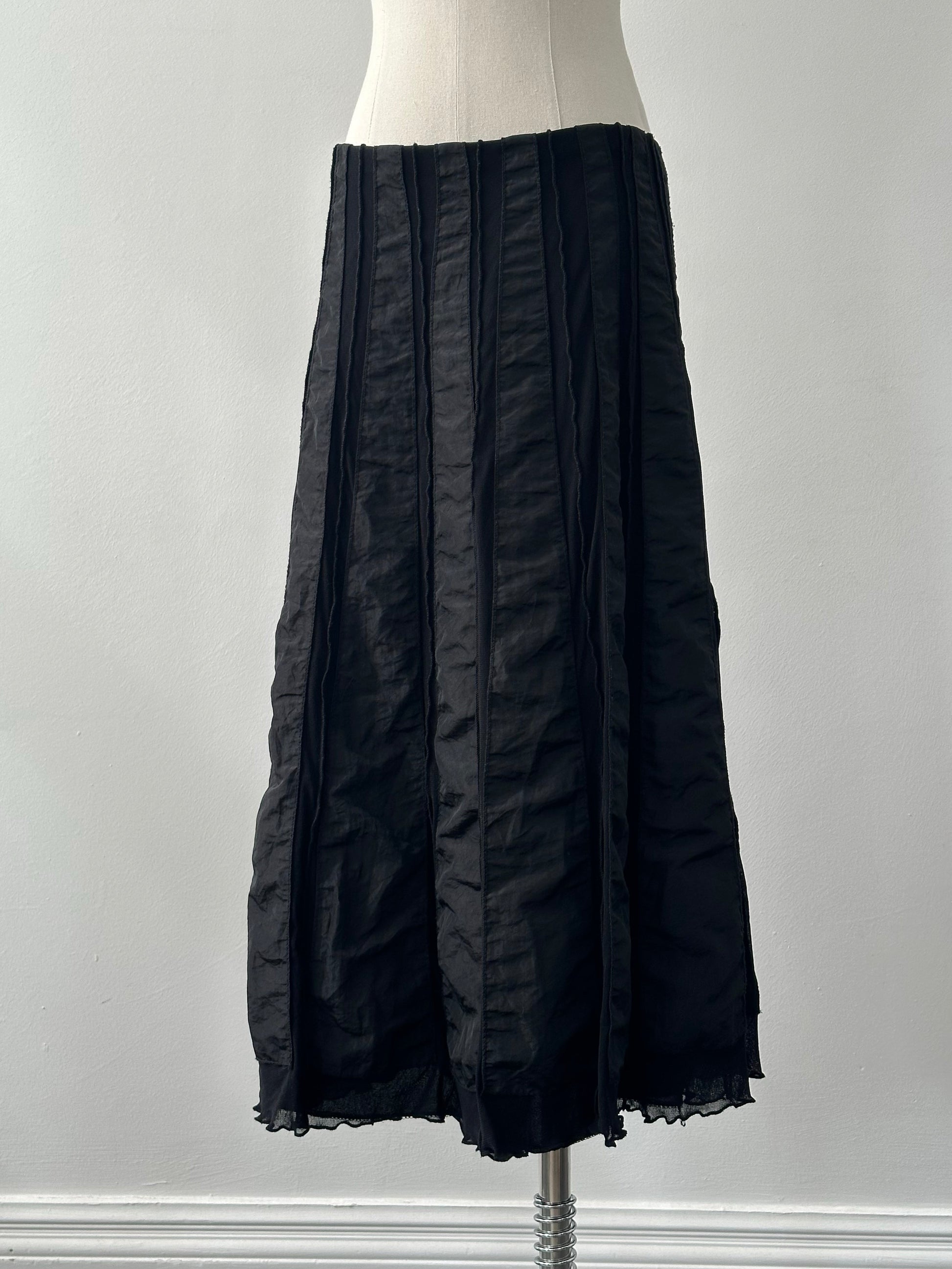 Vintage Italian 1990s satin-paneled midi skirt in W28-32, featuring elegant fabric and classic design, displayed on a neutral background.