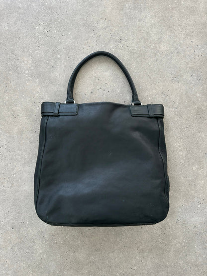 Italian vintage leather shoulder bag from the 2000s with a buckle closure, featuring a classic, worn-in leather design.