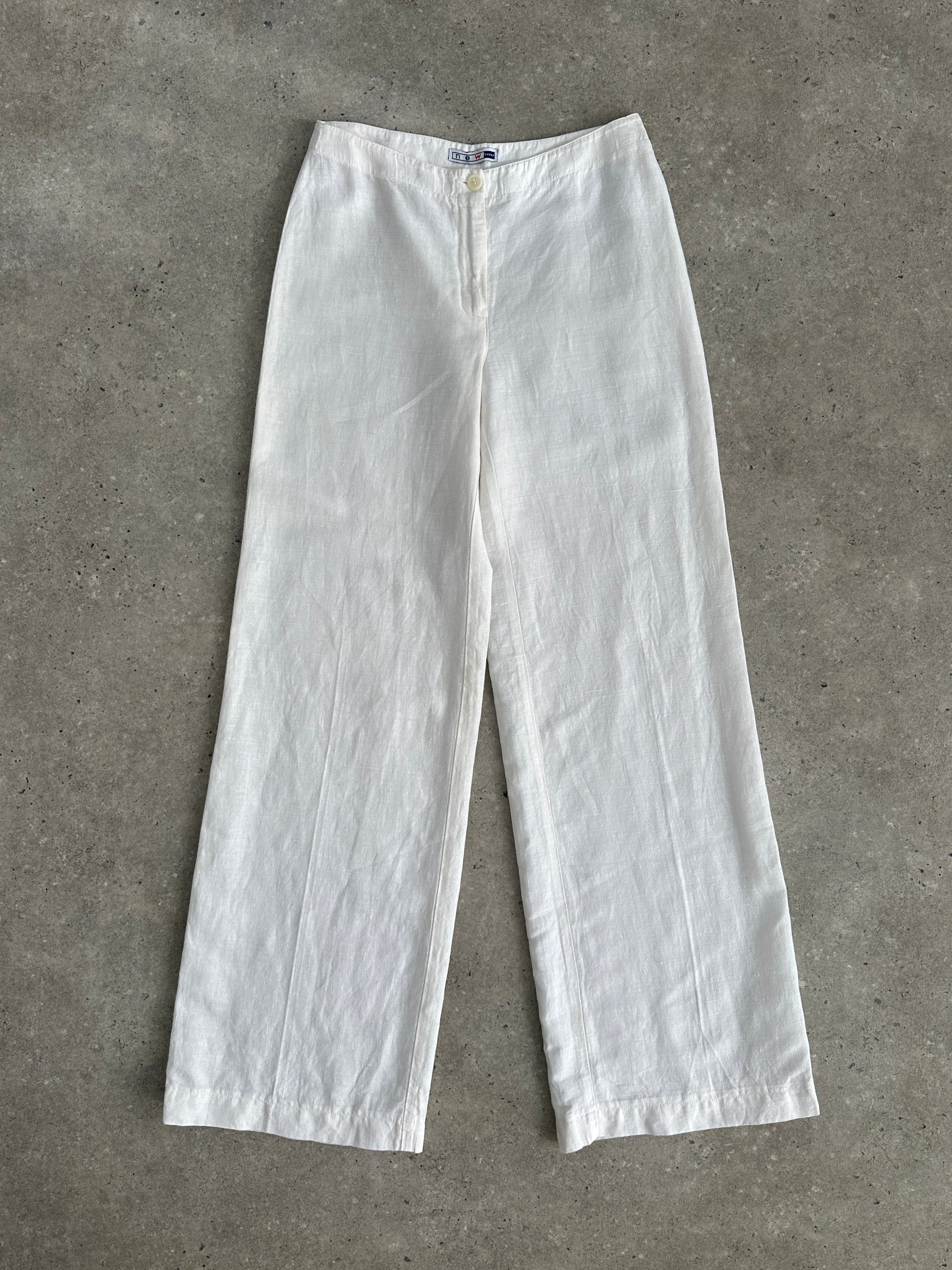 Vintage pure linen low waist wide-leg trousers with relaxed fit and natural fabric, shown on a hanger.