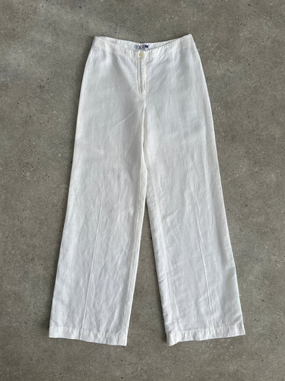 Vintage pure linen low waist wide-leg trousers with relaxed fit and natural fabric, shown on a hanger.