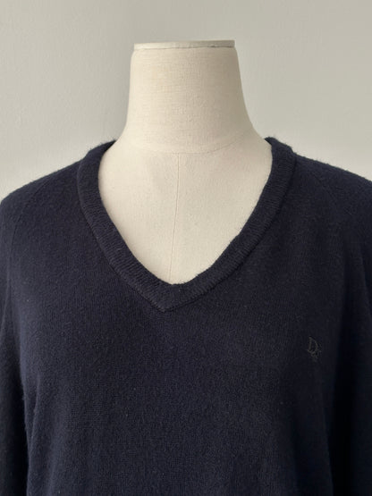 Christian Dior 1990s V-neck logo jumper in black, featuring the iconic Dior branding and classic knit design, worn casually.