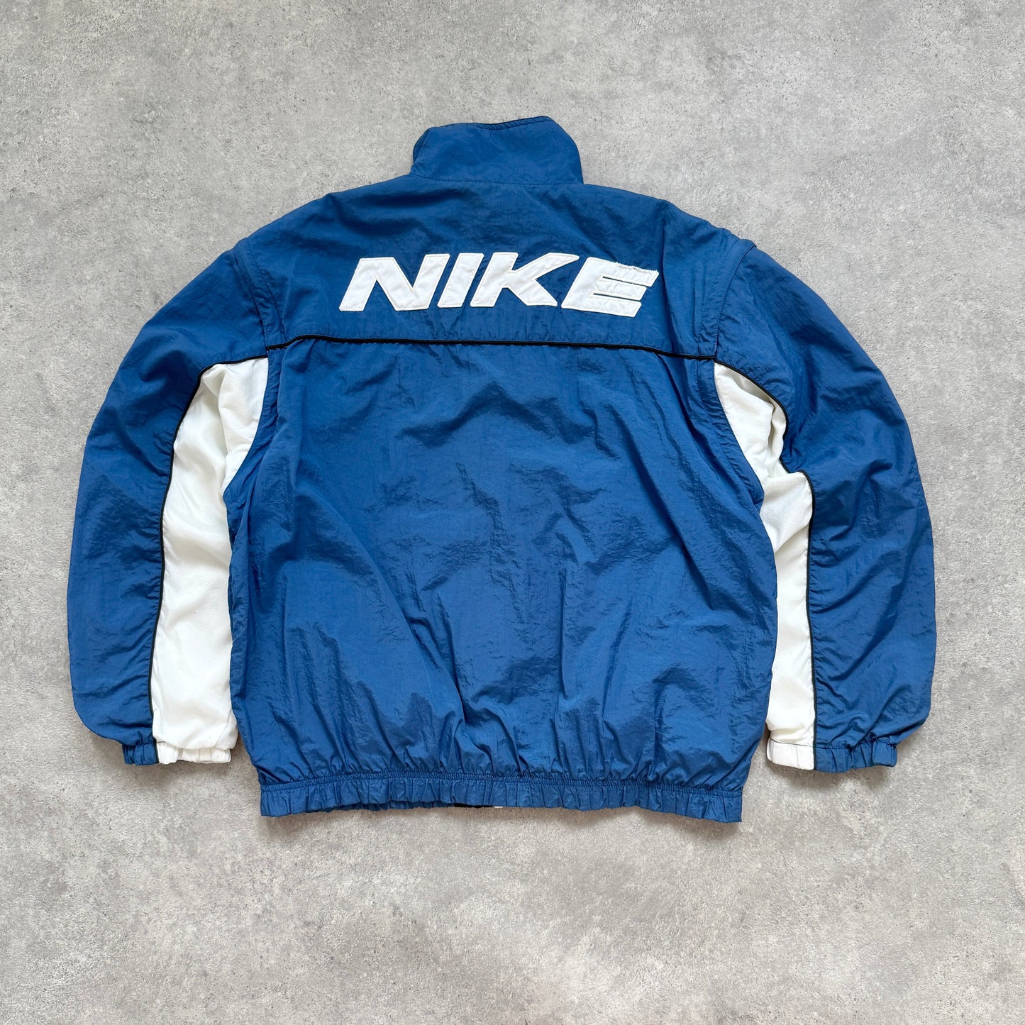 Nike 1990s lightweight convertible spellout shell jacket (M)