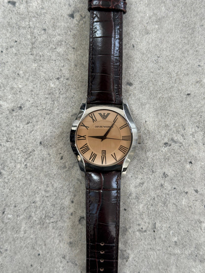 Emporio Armani 2000s leather quartz watch with a sleek round dial and classic design, featuring a leather strap and Armani branding.