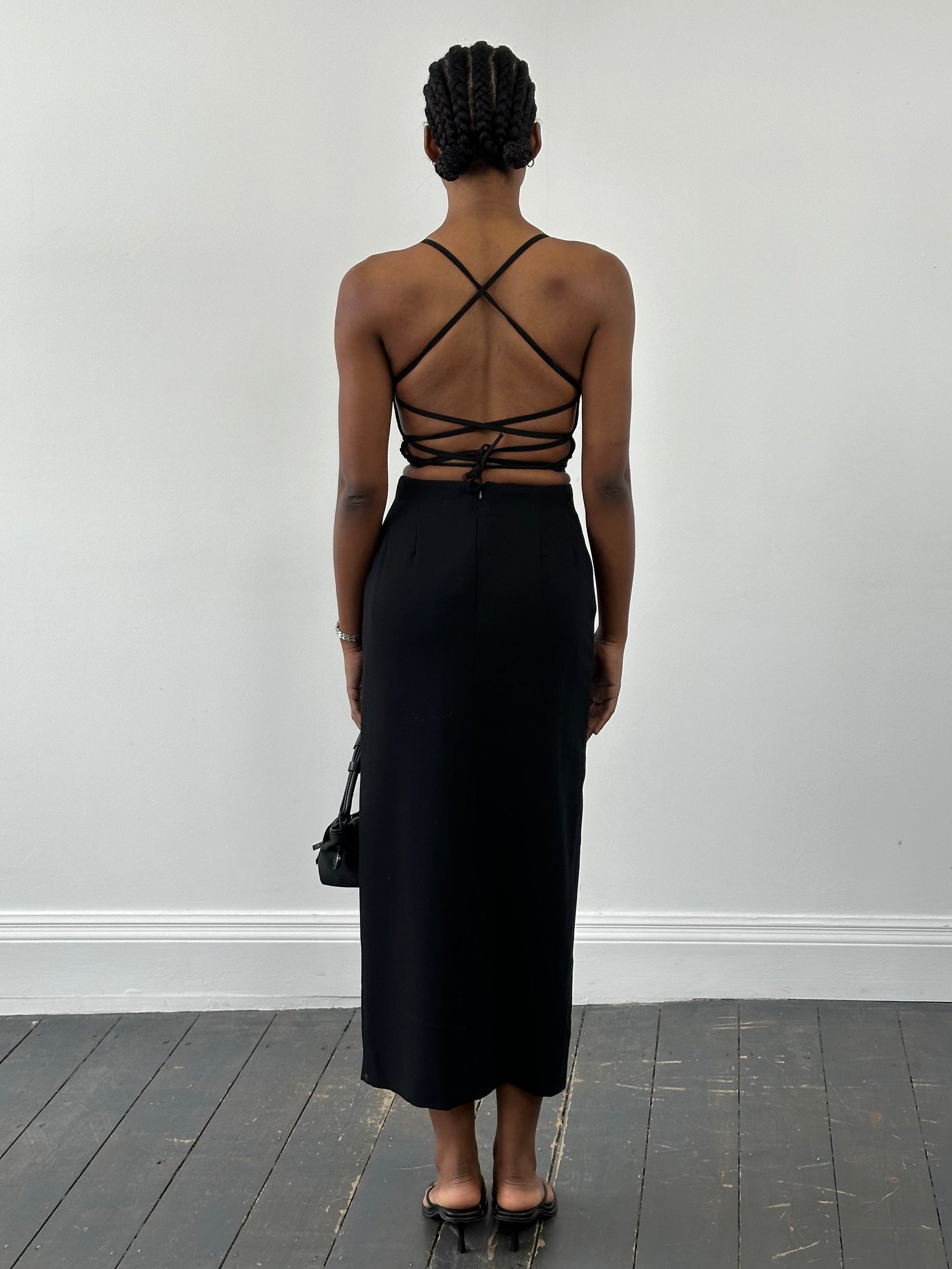 Jaeger 1990s pure wool side split maxi skirt in neutral color, featuring a flowing silhouette and side slit detail.