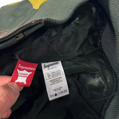 Close-up of the internal care and authenticity labels of a 1036 Emporium leather jacket.