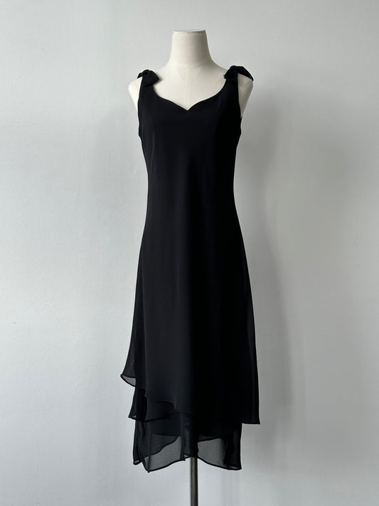Vintage 1990s layered sleeveless midi dress in size S, featuring a retro style and flowing fabric, shown on a hanger.