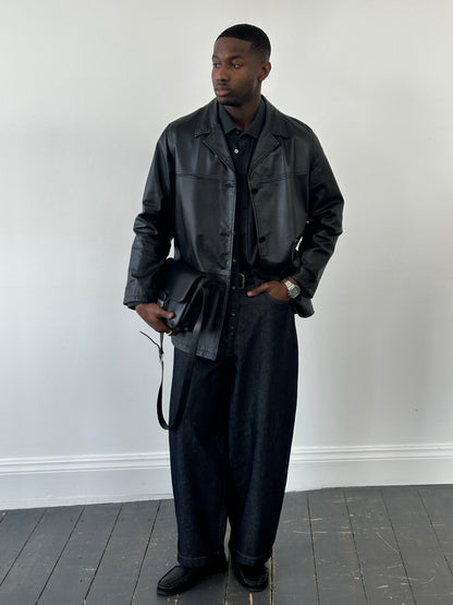 Italian vintage 1990s single-breasted leather jacket by Vintage, shown in classic brown leather with lapel collar and stylish design.