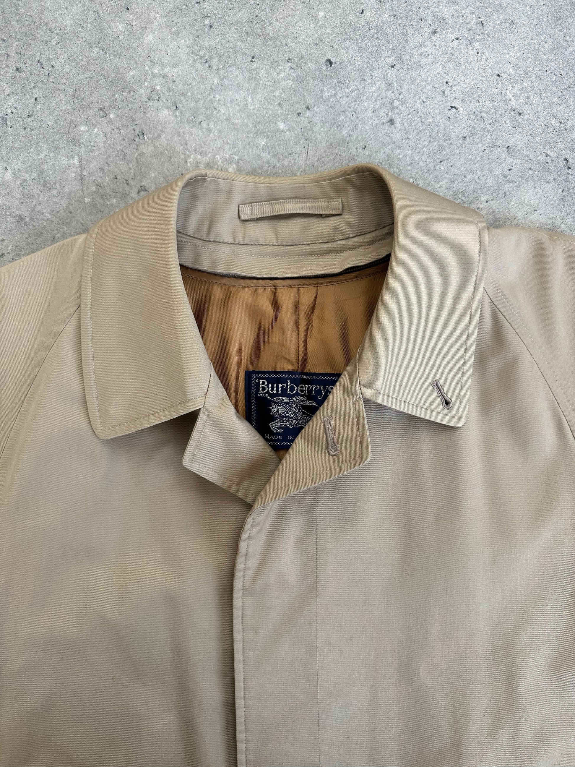 Burberry 1990s pure cotton high neck trench coat in beige, front view, with classic collar and button details.