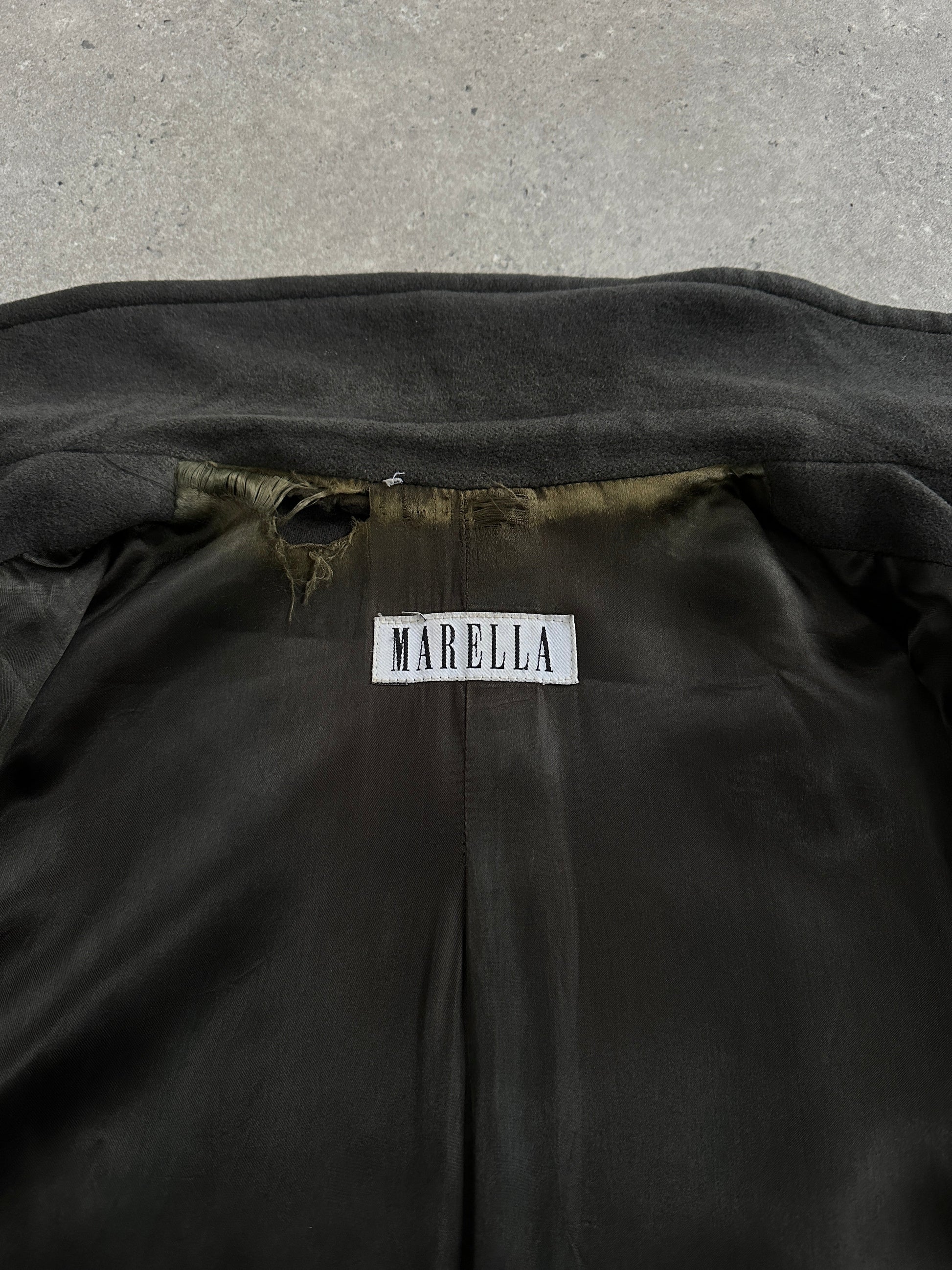 Marella 1990s virgin wool double-breasted coat in size L/XL hanging on a rack with classic design and neutral color.