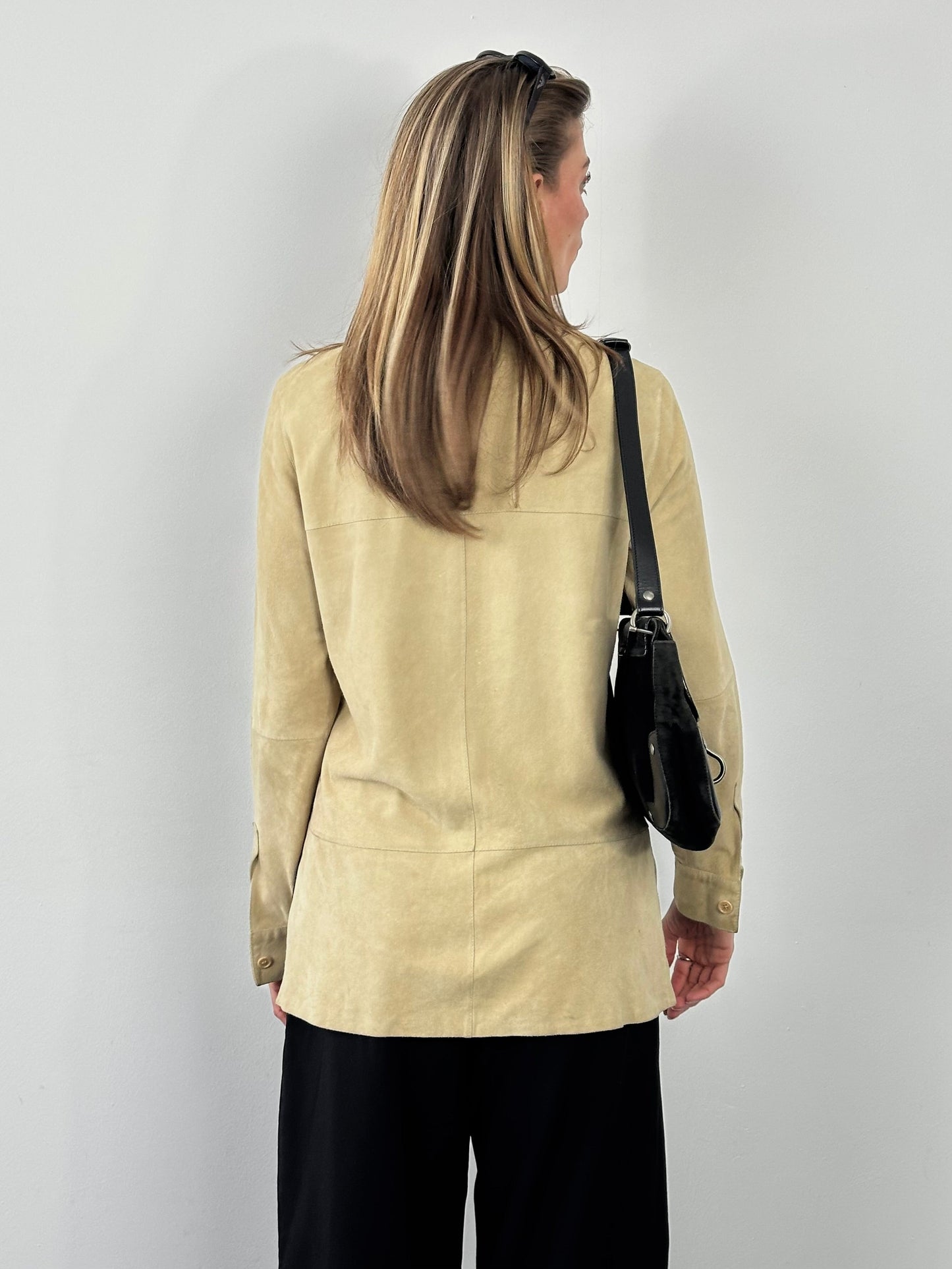 Marella 1990s suede minimal shirt in brown, featuring a classic design and button-down front, displayed on a hanger.