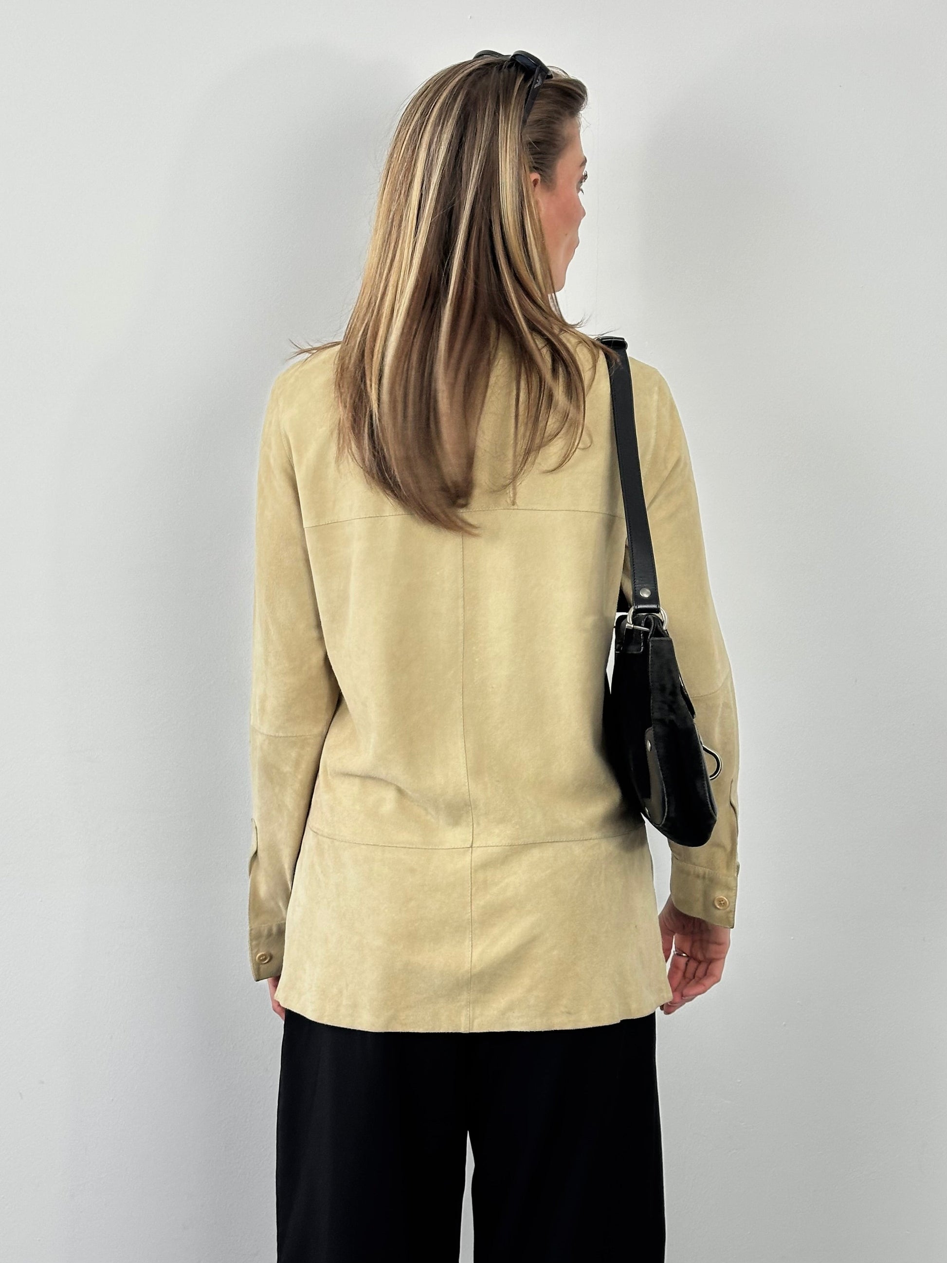 Marella 1990s suede minimal shirt in brown, featuring a classic design and button-down front, displayed on a hanger.