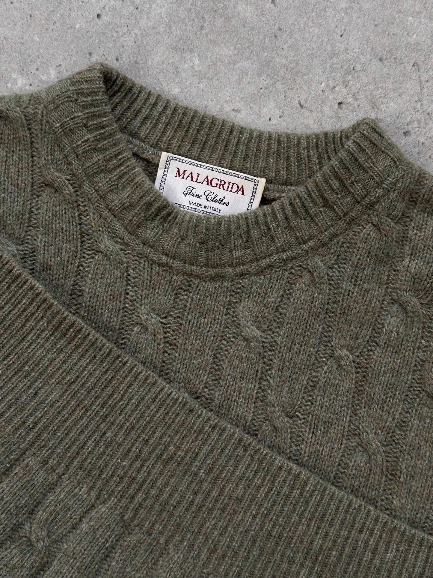 Vintage Italian 1990s wool knitted jumper in XL, featuring a cozy, textured knit pattern and classic style.