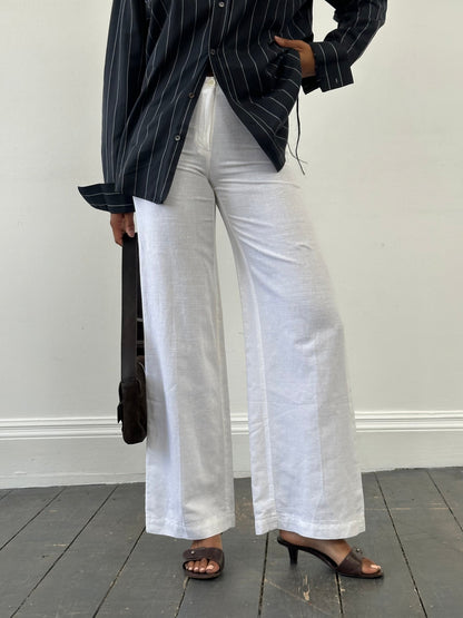 Vintage 1990s pure linen low waist wide-leg trousers in natural beige, size W24, with relaxed fit and vintage style.