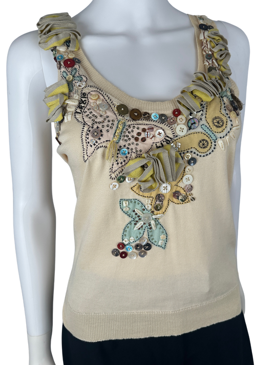 https://cdn.shopify.com/s/files/1/0900/2729/5066/files/Alexander_Mcqueen_2004_Beaded_Butterfly_Tank.png?v=1774459839