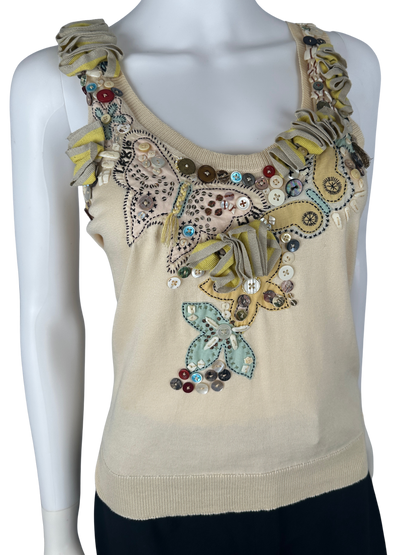 https://cdn.shopify.com/s/files/1/0900/2729/5066/files/Alexander_Mcqueen_2004_Beaded_Butterfly_Tank.png?v=1774459839