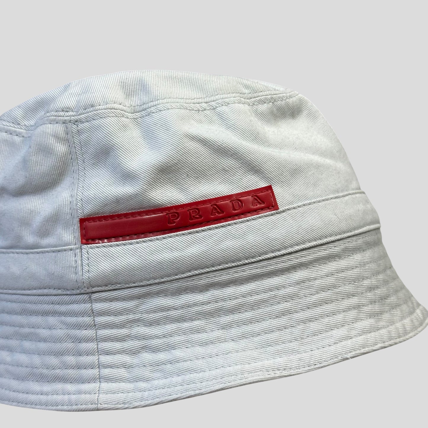 Prada Sport 1999 White Cotton Red Rubber Tab Bucket Hat - M | O/S, Red