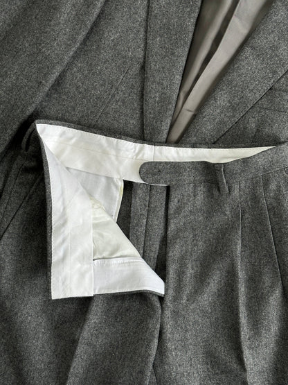 Italian Vintage Pure Wool Single Breasted Suit in XS/W27 laid flat, showcasing tailored lapels and classic design details.