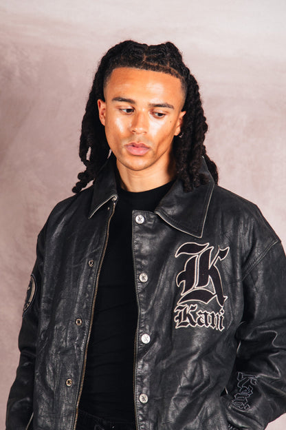 Karl Kani Logo Embossed Black Leather Varsity Jacket | Extra Large, Multicoloured