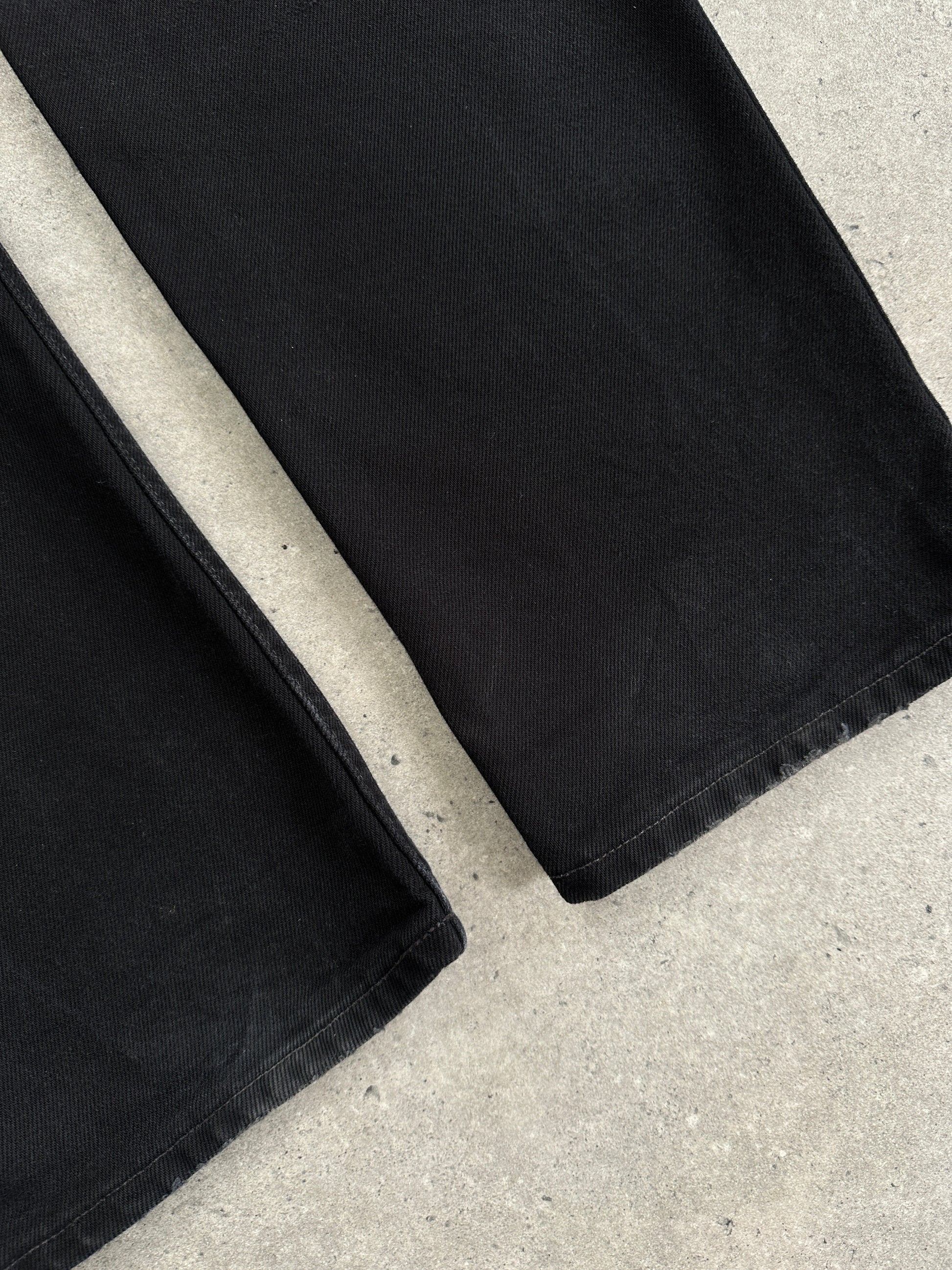 Levi's 521 tapered straight-leg denim jeans in W31, showing classic blue denim fabric and a modern fit.