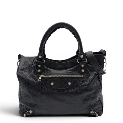 https://cdn.shopify.com/s/files/1/0564/9376/8855/files/Balenciaga_City_Velo_Umhangetasche_schwarz_Leder_vintage7566.webp?v=1779405754