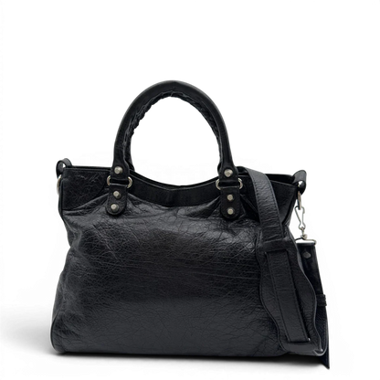 https://cdn.shopify.com/s/files/1/0564/9376/8855/files/Balenciaga_City_Velo_Umhangetasche_schwarz_Leder_vintage7567.webp?v=1779405754