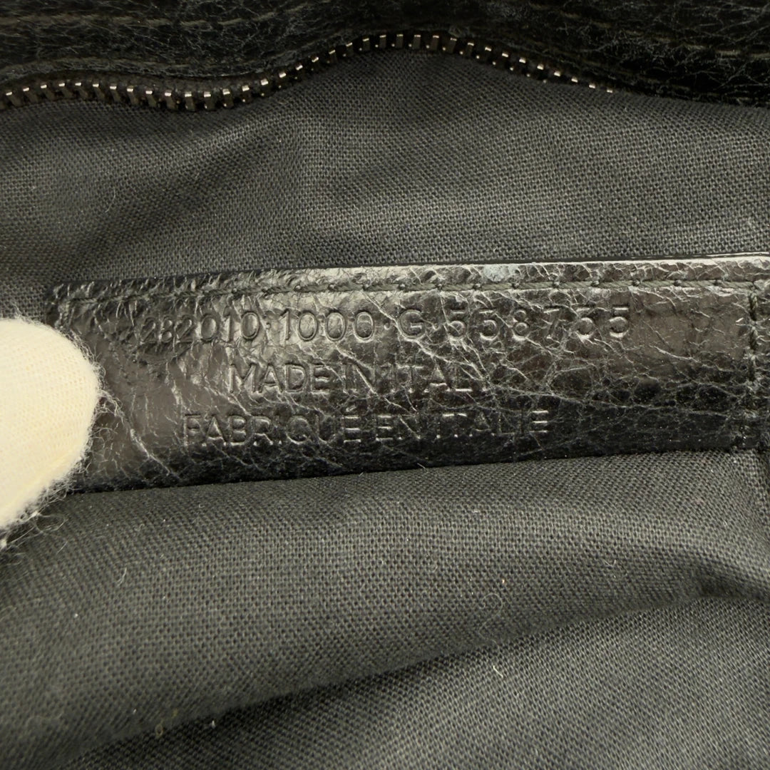https://cdn.shopify.com/s/files/1/0564/9376/8855/files/Balenciaga_City_Velo_Umhangetasche_schwarz_Leder_vintage7581.webp?v=1779405755