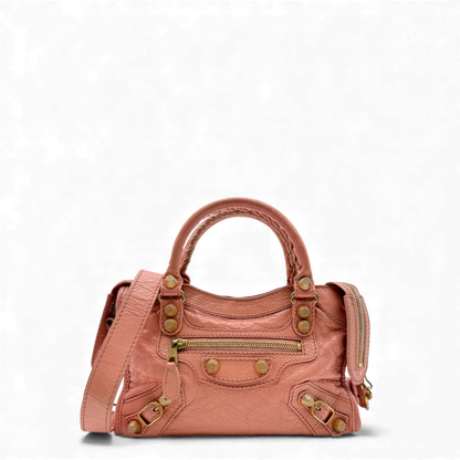https://cdn.shopify.com/s/files/1/0564/9376/8855/files/Balenciaga_Handtasche_Gianty_City_mini_aus_Leder_rosa_vintage_handbag4257.webp?v=1764853428