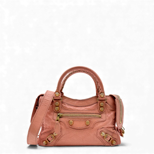 https://cdn.shopify.com/s/files/1/0564/9376/8855/files/Balenciaga_Handtasche_Gianty_City_mini_aus_Leder_rosa_vintage_handbag4257.webp?v=1764853428