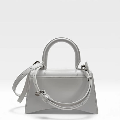https://cdn.shopify.com/s/files/1/0564/9376/8855/files/Balenciaga_Handtasche_Hourglass_XS_mit_Schultergurt_aus_Leder_weiss_handbag_6010.webp?v=1766108771