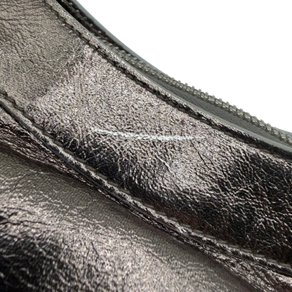 https://cdn.shopify.com/s/files/1/0564/9376/8855/files/Balenciaga_Handtasche_The_First_City_Bag_aus_Leder_silber___chrome_vintage6594.webp?v=1778675915