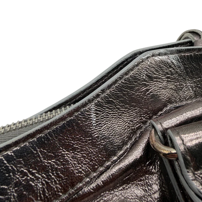 https://cdn.shopify.com/s/files/1/0564/9376/8855/files/Balenciaga_Handtasche_The_First_City_Bag_aus_Leder_silber___chrome_vintage6595.webp?v=1778675915