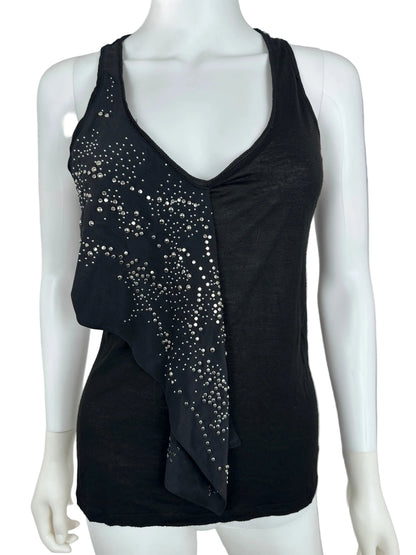 Black top with stud details on a mannequin against a neutral background