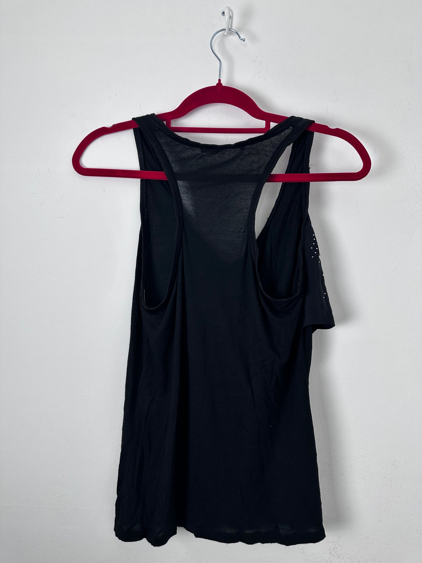 Black tank on a red hanger against a white background