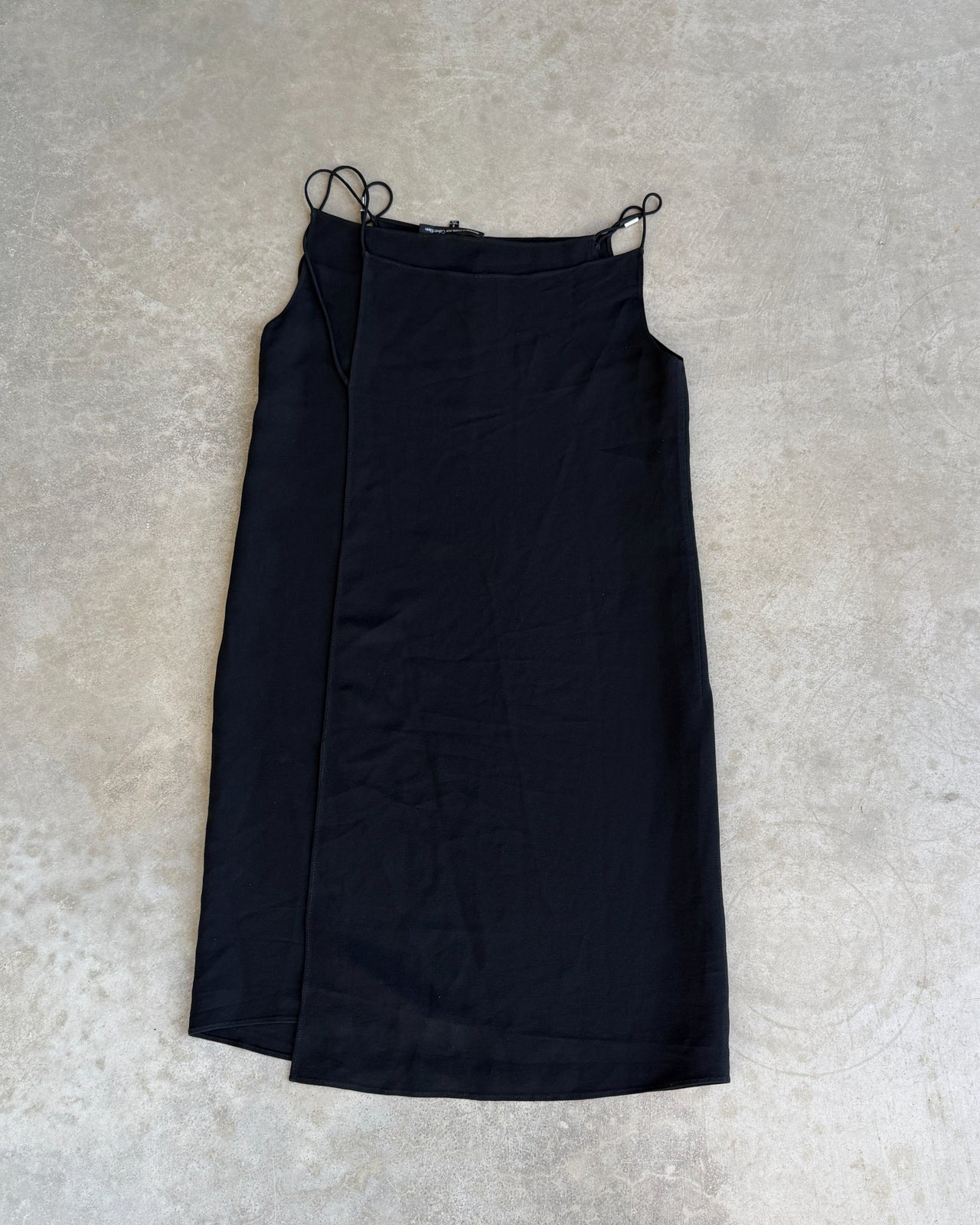 Francisco Costa for Calvin Klein Black Wrap Panel Dress-on a concrete background