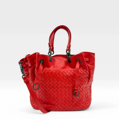 https://cdn.shopify.com/s/files/1/0564/9376/8855/files/Bottega_Veneta_Handtasche_Bucket_Intrecciato_mit_Umhaengegurt_aus_Leder_rot_vintage_designer_handbag_3318.webp?v=1744271399