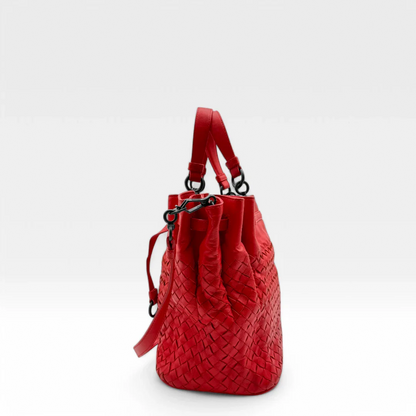 https://cdn.shopify.com/s/files/1/0564/9376/8855/files/Bottega_Veneta_Handtasche_Bucket_Intrecciato_mit_Umhaengegurt_aus_Leder_rot_vintage_designer_handbag_3321.webp?v=1744271924