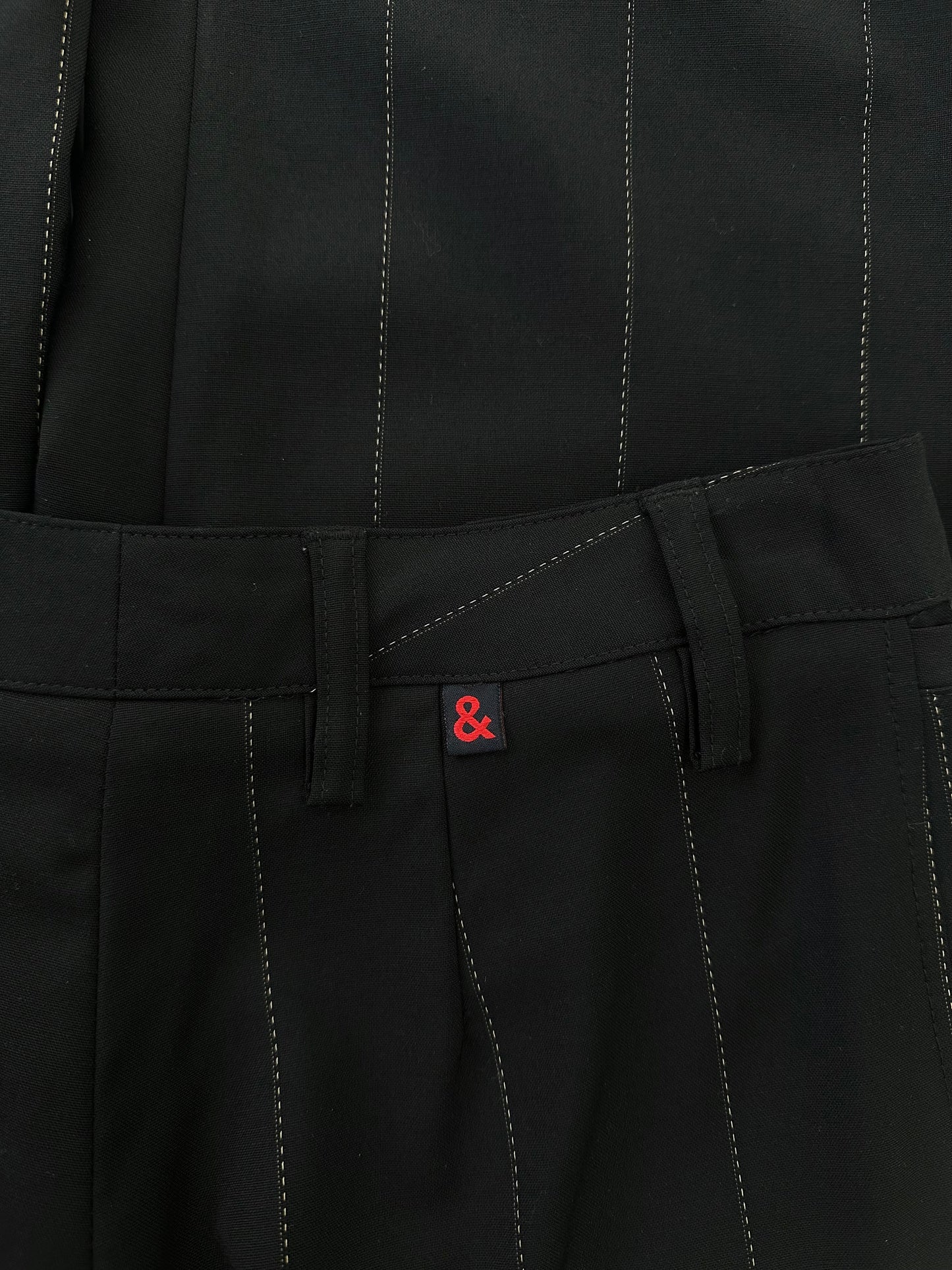 Dolce & Gabbana 2000s wool trousers in size W28, tailored fit, dark color, with classic waistband and front pockets.