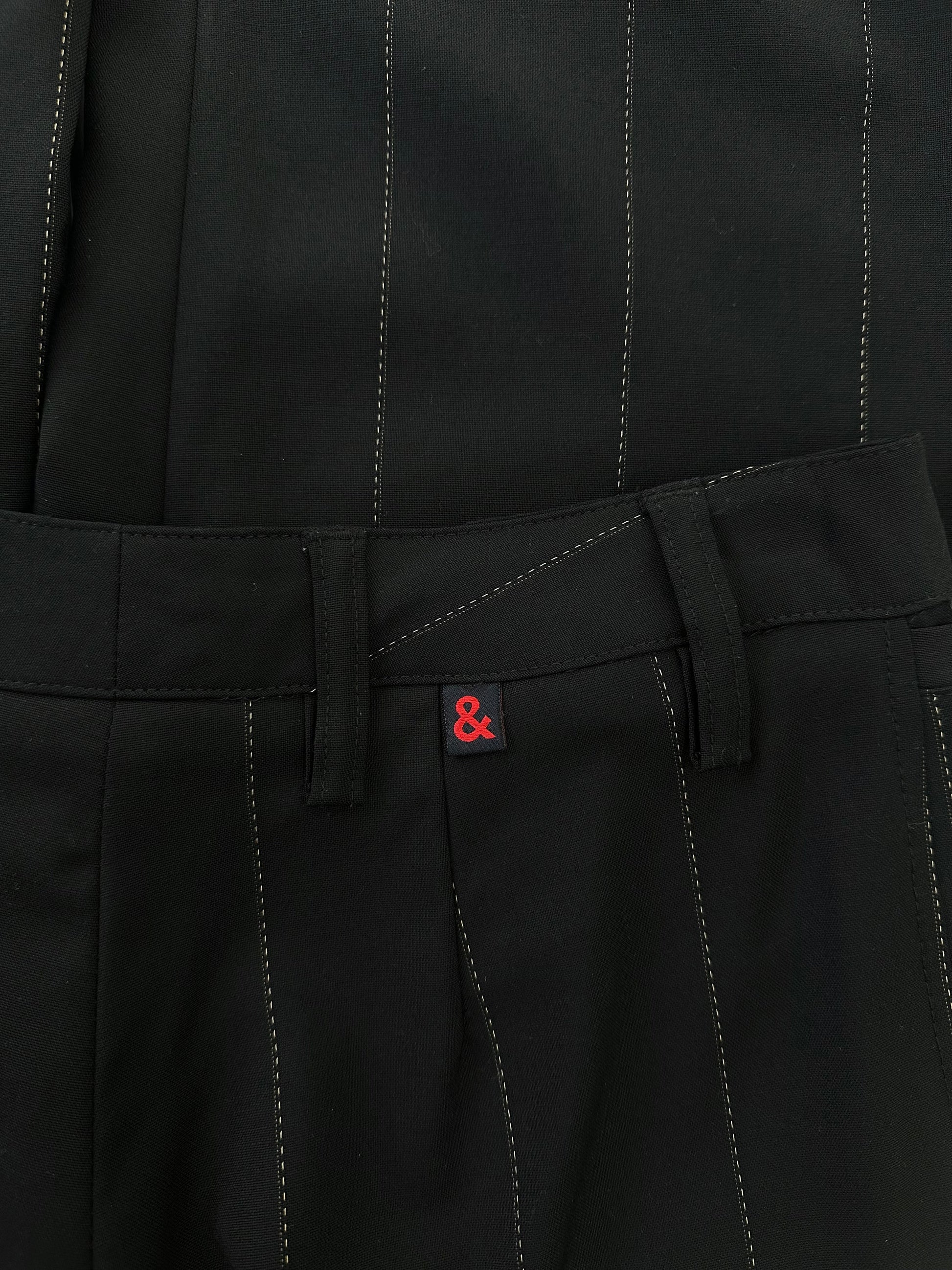 Dolce & Gabbana 2000s wool trousers in size W28, tailored fit, dark color, with classic waistband and front pockets.