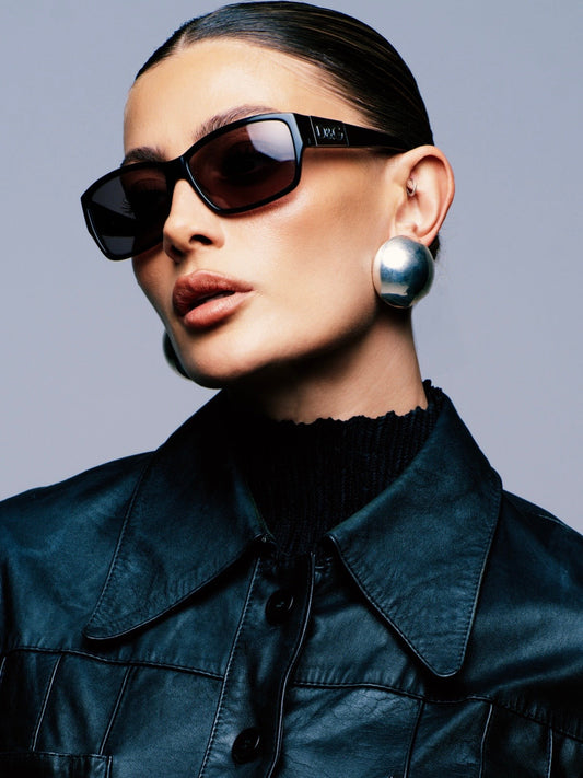Dolce & Gabbana 2000s rectangle logo sunglasses with black frames and dark tinted lenses, stylish eyewear for a bold look.