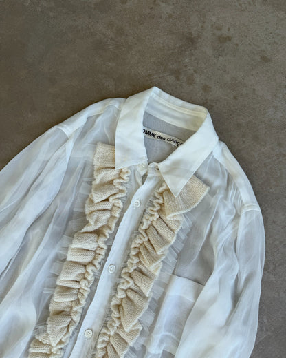 Comme des Garçons Sheer White Shirt-on a concrete background