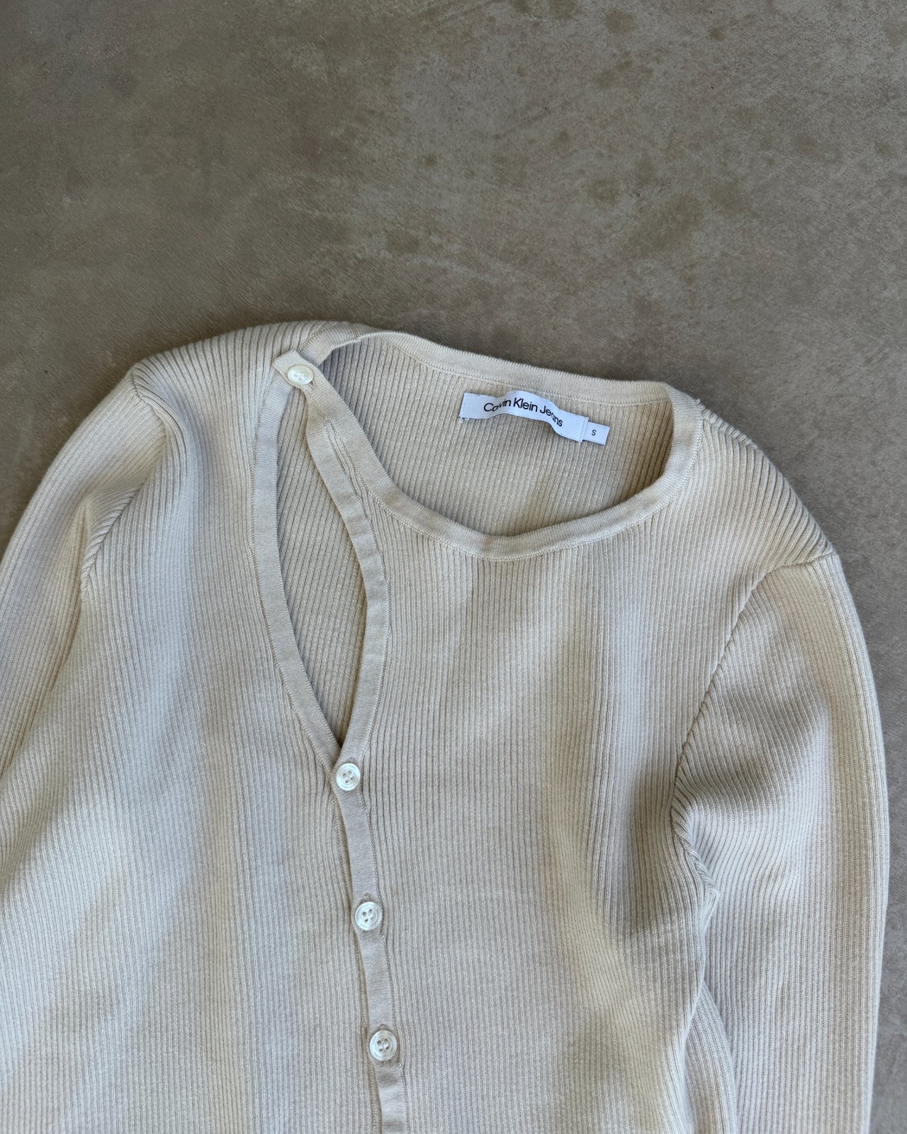 Calvin Klein Jeans Ribbed Asymmetric Long Sleeve Cardigan – S-on a concrete background