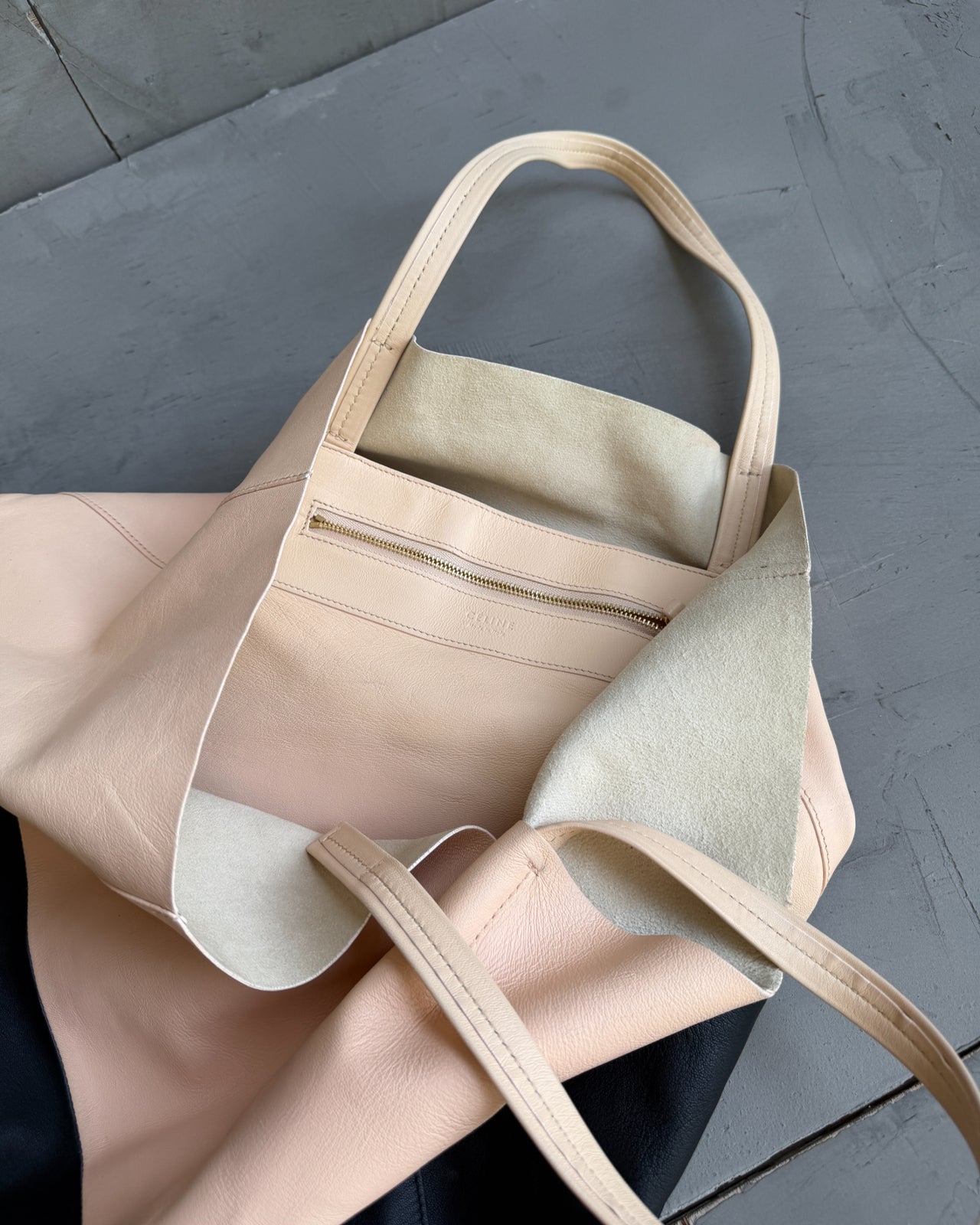 Celine Two Tone Leather Tote Bag-on a concrete background