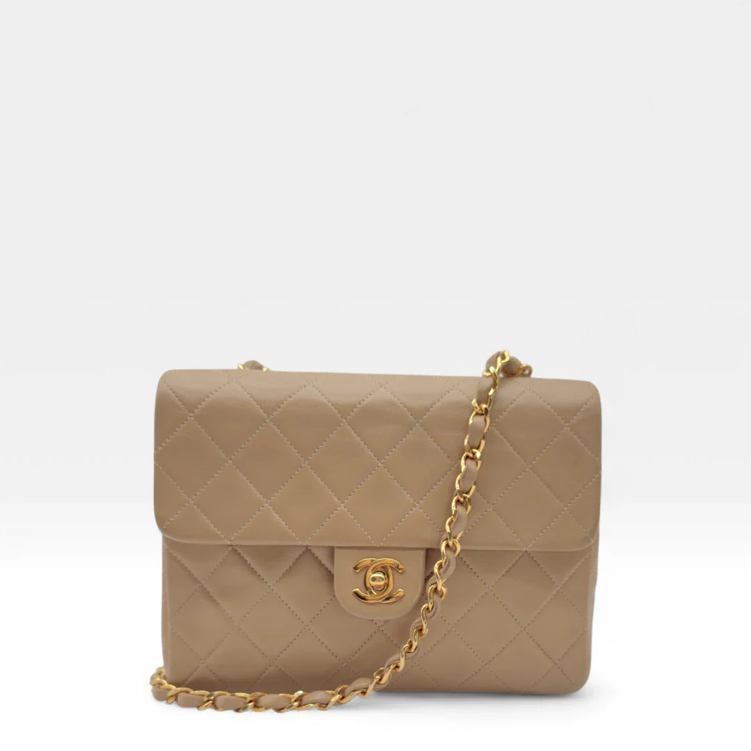 https://cdn.shopify.com/s/files/1/0564/9376/8855/files/Chanel_Flap_Bag-Beige5193.webp?v=1754669919