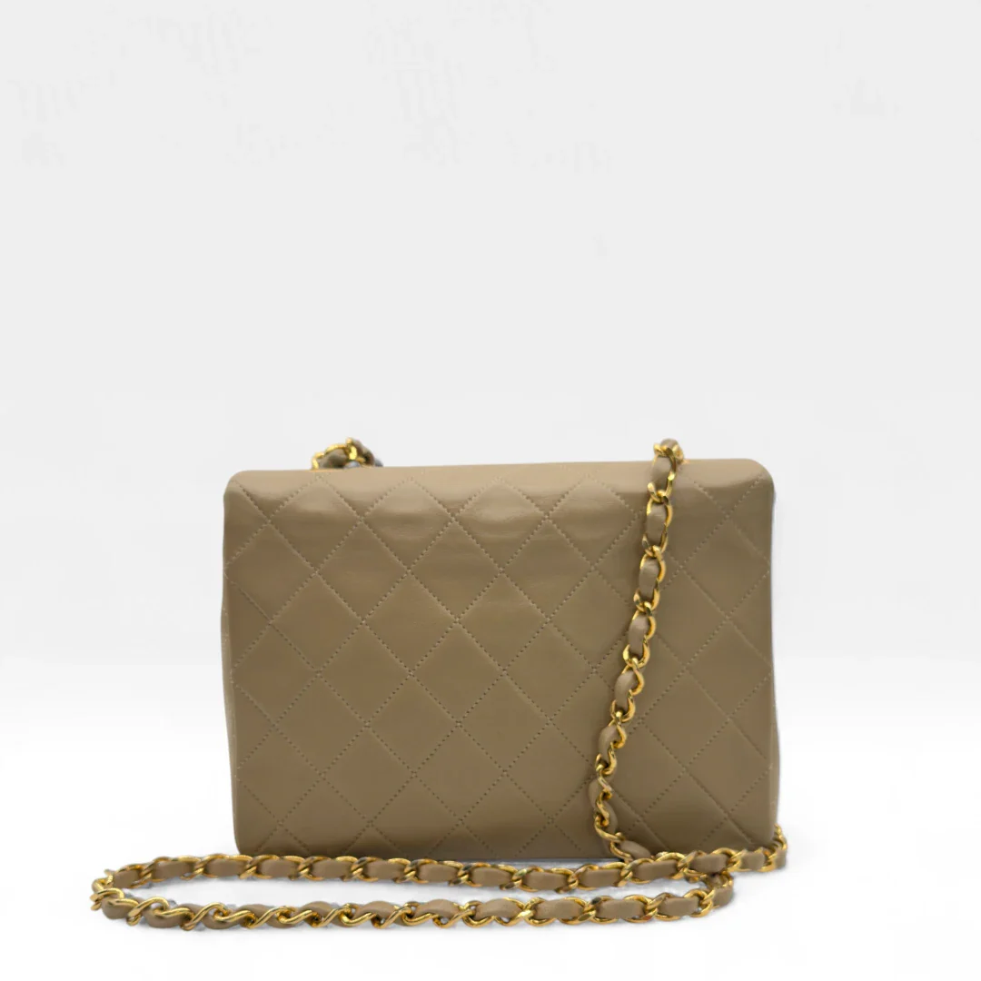 https://cdn.shopify.com/s/files/1/0564/9376/8855/files/Chanel_Flap_Bag-Beige5195.webp?v=1754669919