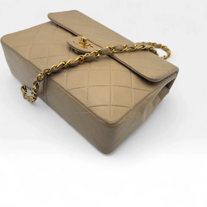 https://cdn.shopify.com/s/files/1/0564/9376/8855/files/Chanel_Flap_Bag-Beige5197.webp?v=1754669919