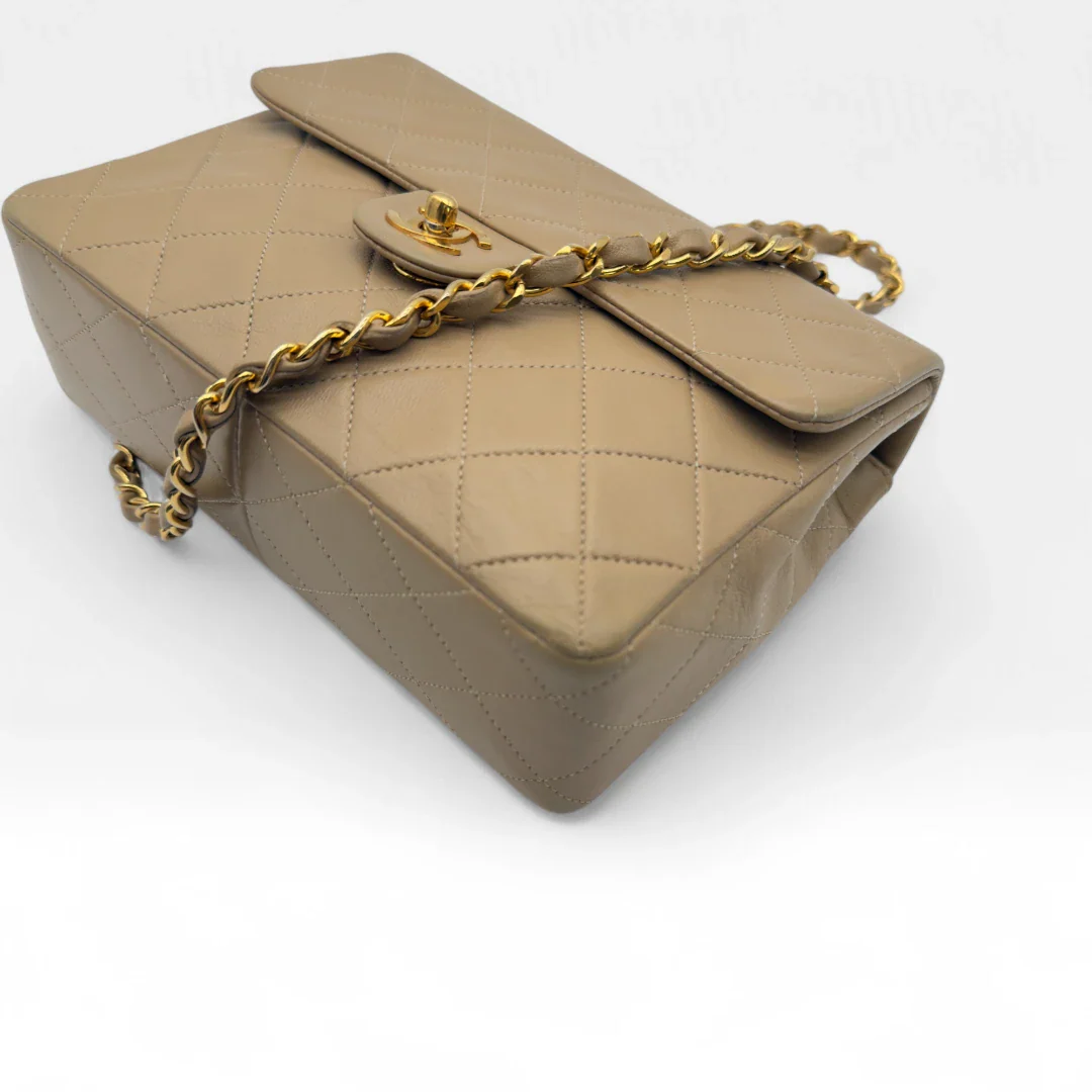 https://cdn.shopify.com/s/files/1/0564/9376/8855/files/Chanel_Flap_Bag-Beige5197.webp?v=1754669919