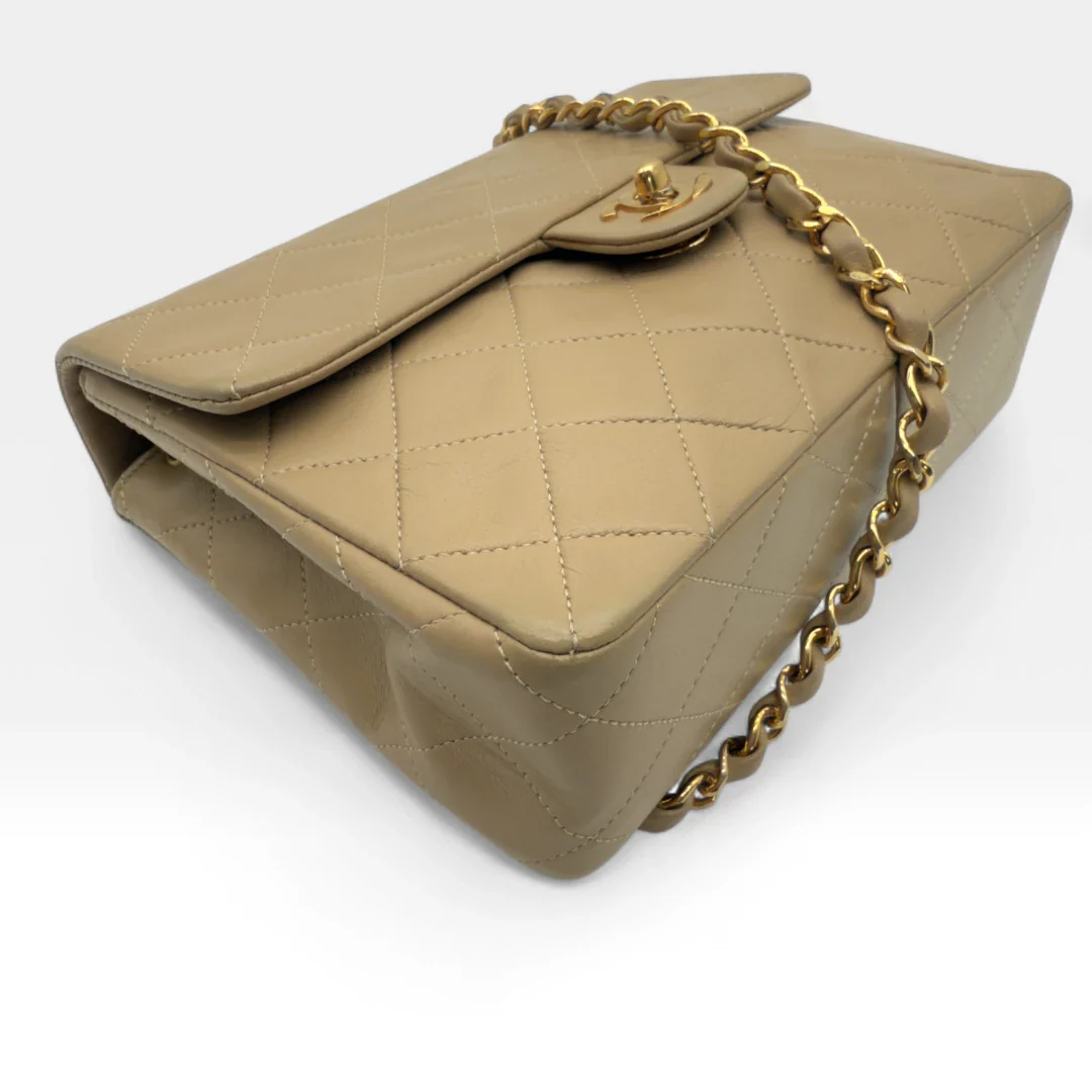 https://cdn.shopify.com/s/files/1/0564/9376/8855/files/Chanel_Flap_Bag-Beige5198.webp?v=1754669919