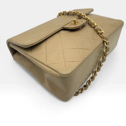 https://cdn.shopify.com/s/files/1/0564/9376/8855/files/Chanel_Flap_Bag-Beige5198.webp?v=1754669919